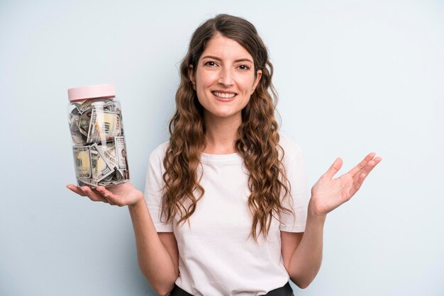 Pretty young adult woman with dollar banknotes bottle savings concept