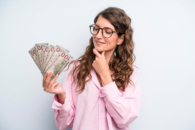 Pretty young adult woman with dollar banknotes