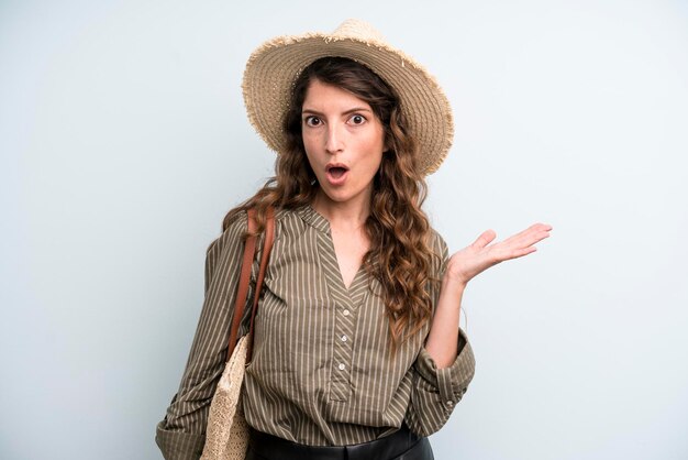 Pretty young adult woman with a hat summer concept