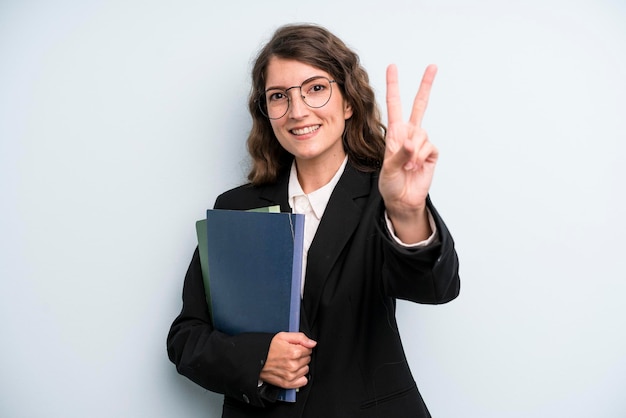 Pretty young adult woman with notebooks business concept