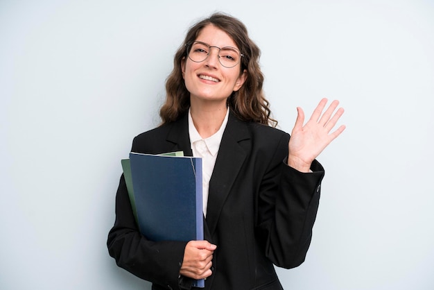 Pretty young adult woman with notebooks business concept