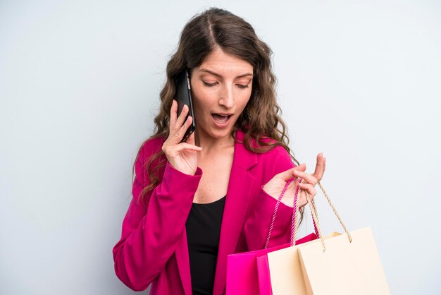 Pretty young adult woman with shopping bags