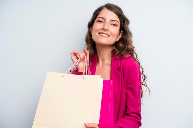 Pretty young adult woman with shopping bags