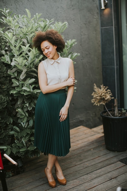 Pretty young african descent woman in the yard