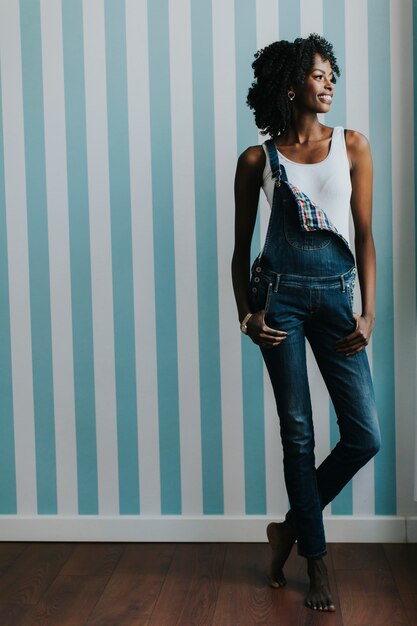 Pretty young black woman standing in the room