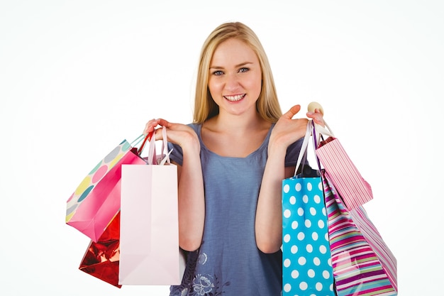 Pretty young blonde holding shopping bags