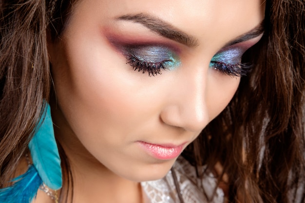 Pretty young brunette woman studio portrait