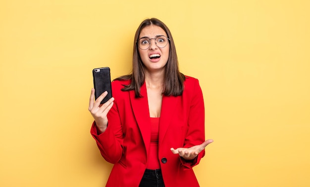 pretty young businesswoman holding a phone