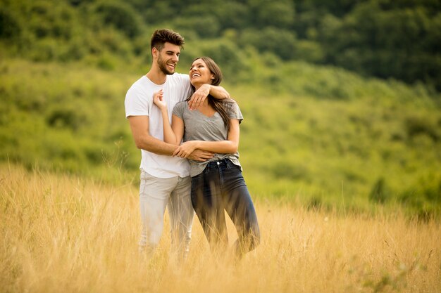 Pretty young couple in love outside in spring nature