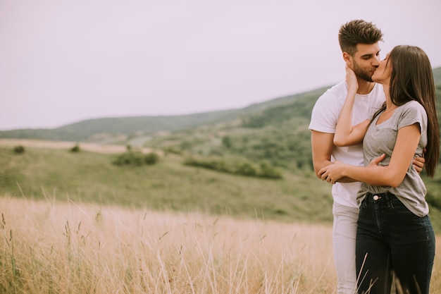 Pretty young couple in love outside in spring nature