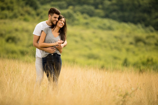 pretty young couple in love outside in spring nature