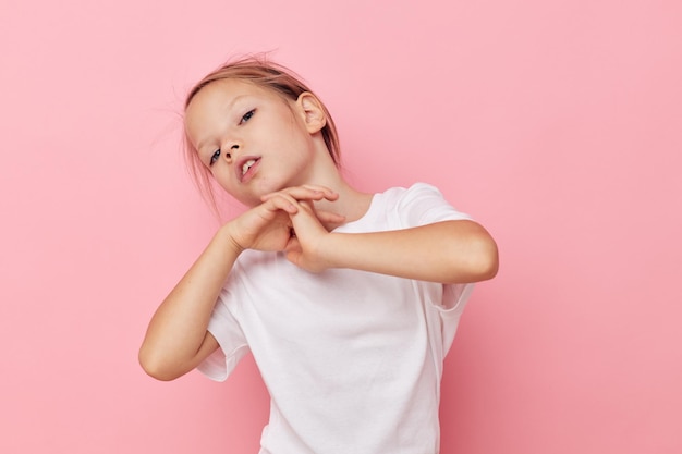 Pretty young girl grimace posing fun childhood unaltered