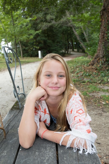 Pretty young girl laughing in a park