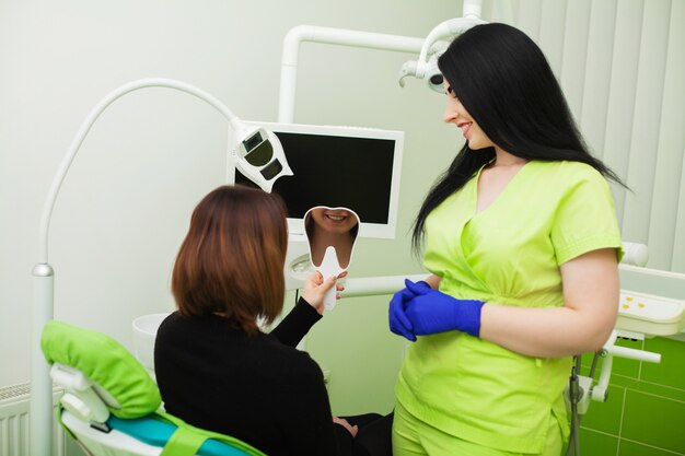 Pretty young girl at a reception in the dental office