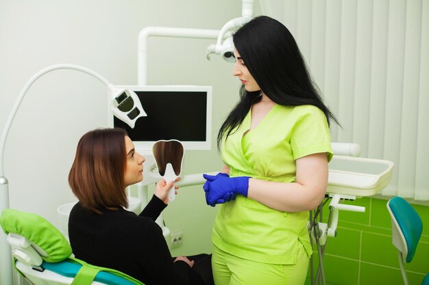 Pretty young girl at a reception in the dental office