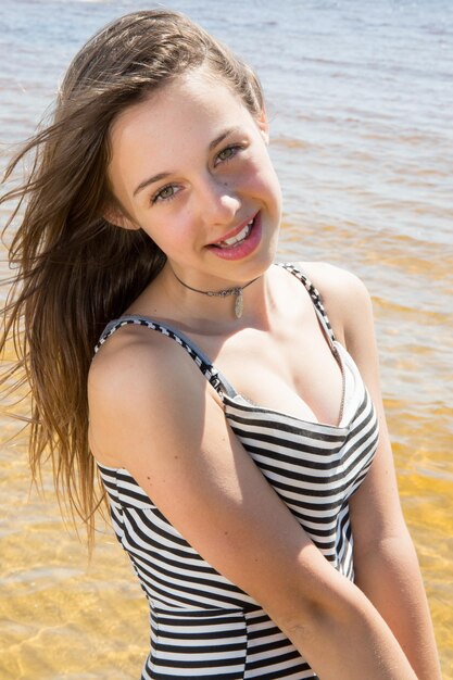 Pretty Young girl  refreshing at the ocean