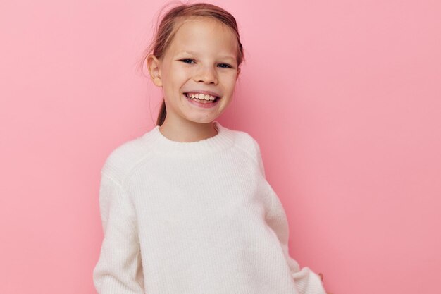 Pretty young girl white sweater posing fun childhood unaltered