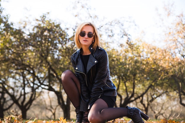 Pretty young slim woman in rock black style