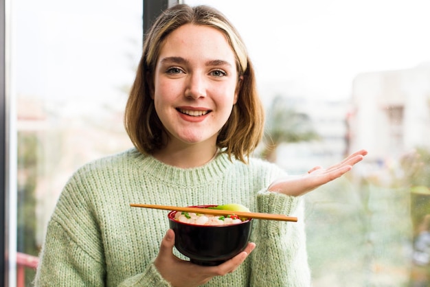 Pretty young woman eating a ramen chinese noodles bowl house interior design