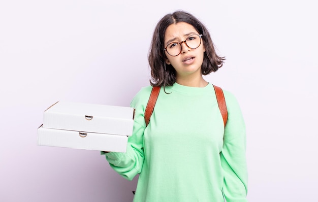 Pretty young woman feeling puzzled and confused take away concept