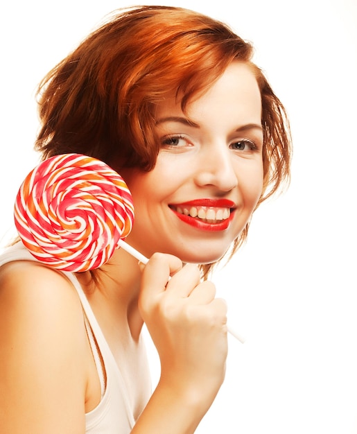 Pretty young woman holding lolly pop