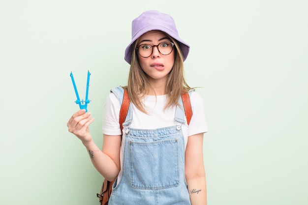 pretty young woman looking puzzled and confused. student concept