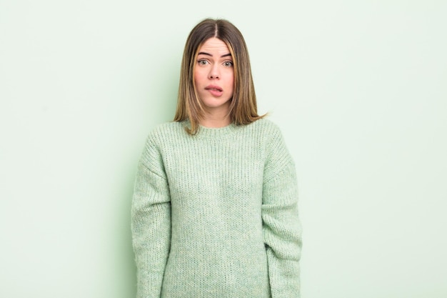 pretty young woman looking puzzled and confused