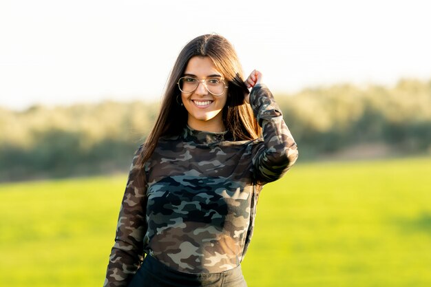 Pretty young woman on nature background