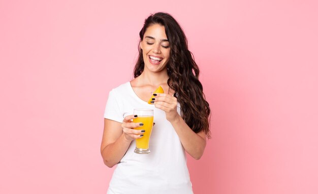 Pretty young woman. orange juice concept