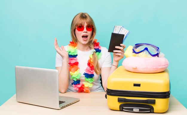 pretty young woman planning her holidays summer or vacations concept