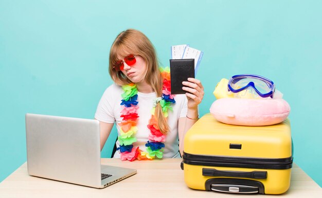 pretty young woman planning her holidays summer or vacations concept