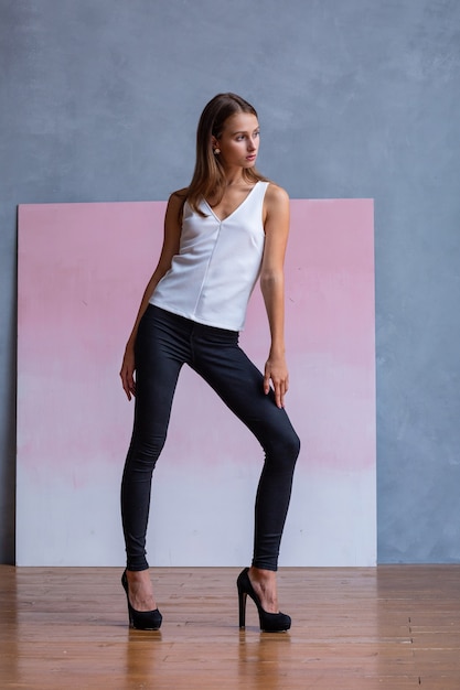 Pretty young woman posing in the studio