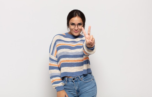 Pretty young woman smiling and looking happy