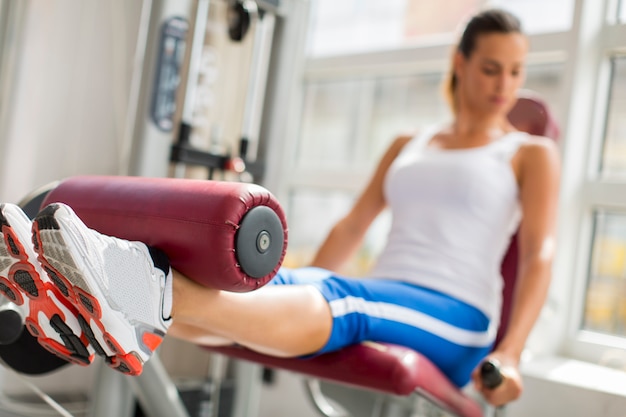 Pretty young woman training in the gym