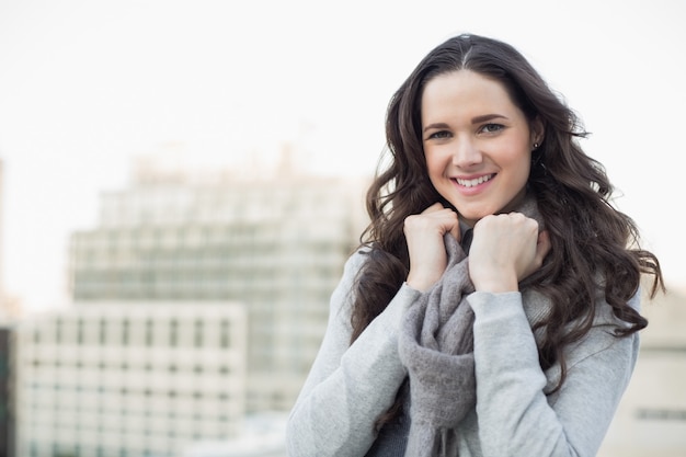 Pretty young woman in winter clothes posing