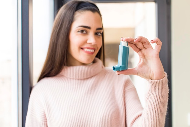 Pretty young woman with an asthma inhaler house interior design