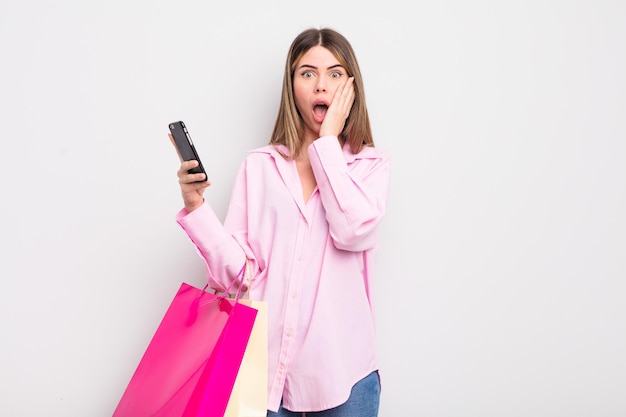 Pretty young woman with shopping bags