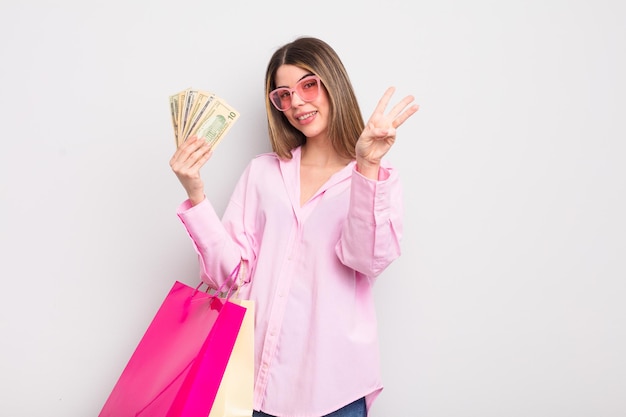 Pretty young woman with shopping bags