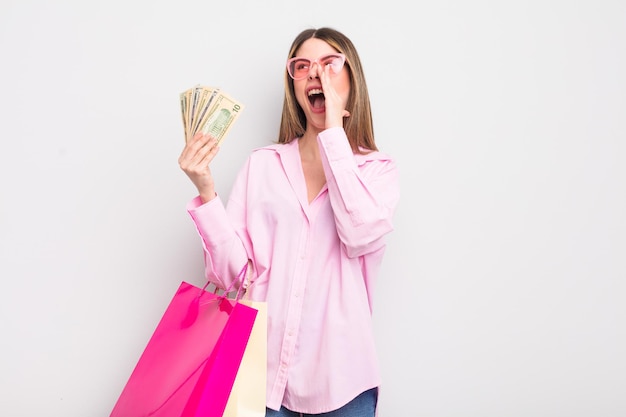 Pretty young woman with shopping bags