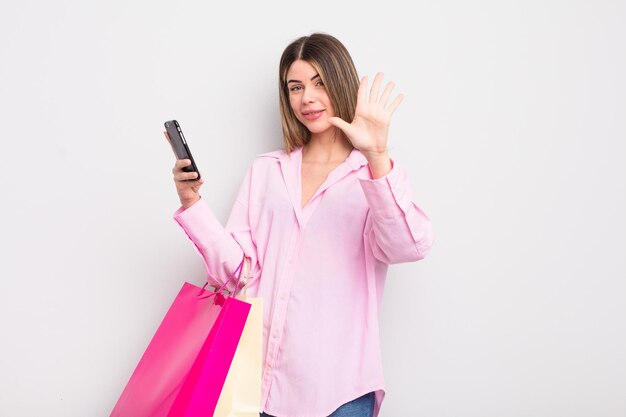 pretty young woman with shopping bags