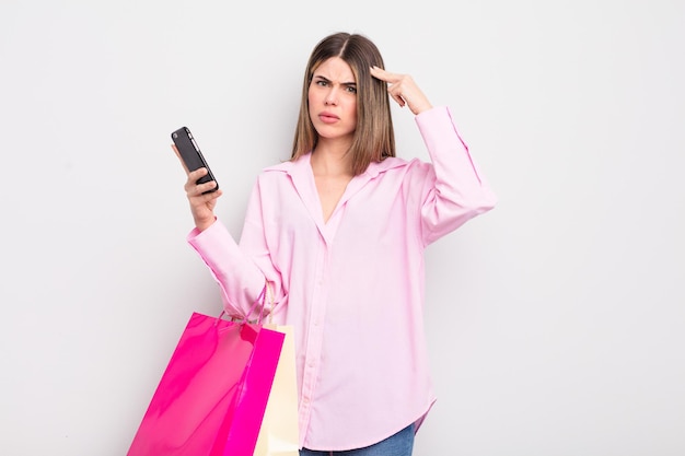 Pretty young woman with shopping bags