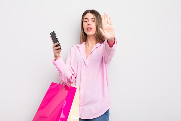 Pretty young woman with shopping bags