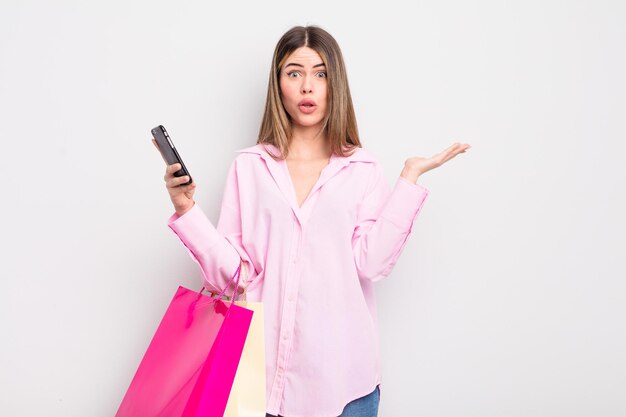 Pretty young woman with shopping bags