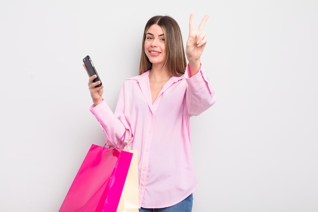 Pretty young woman with shopping bags