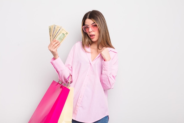 Pretty young woman with shopping bags