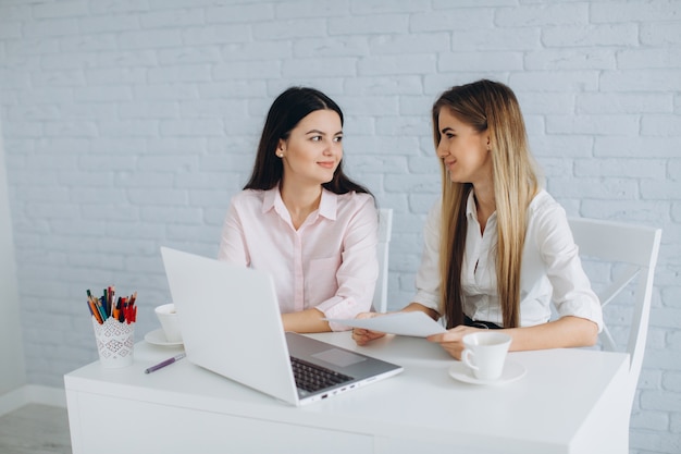 Pretty young women in office