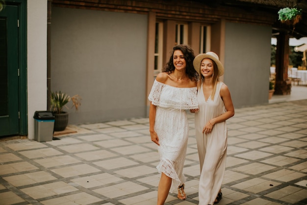 Pretty young women walking in the resort