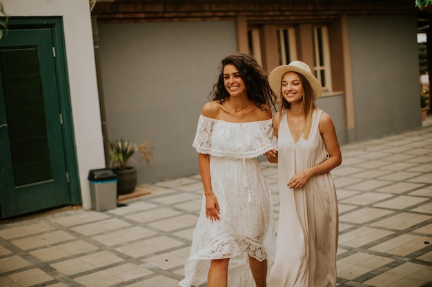 Pretty young women walking in the resort