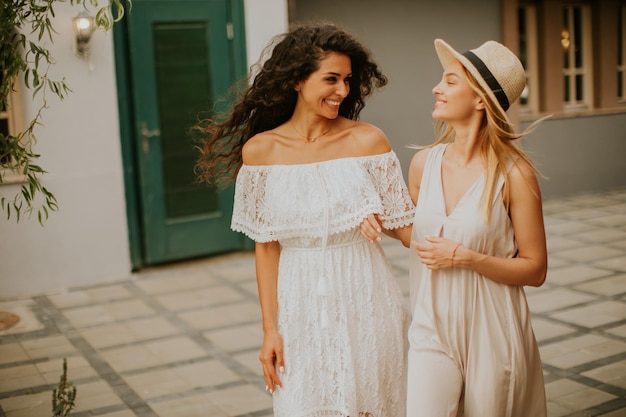 Pretty young women walking in the resort