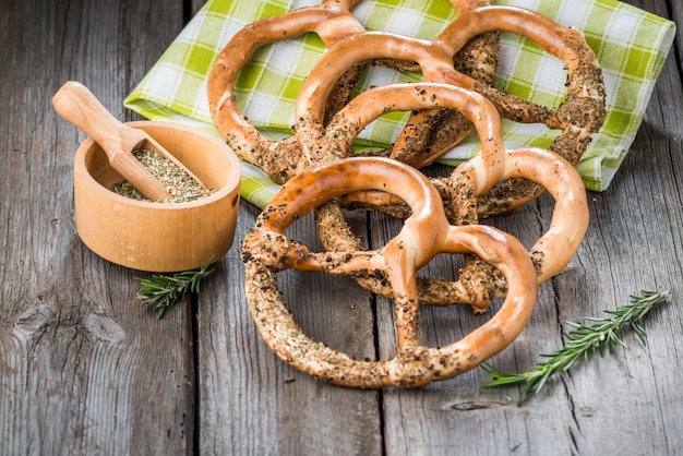 Pretzels on wooden board on rustic background